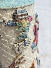 A pair of Chinese famille rose relief-moulded 'Immortals' vases, Qianlong mark, Republic