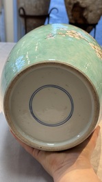 A pair of fine Chinese famille verte turquoise-ground 'Magpie and Prunus' jars with reticulated wooden covers, 19th C.