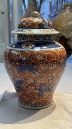 A Chinese blue, white and iron-red decorated 'Mythical Animals' vase and cover, 19th C.