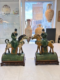 A pair of Chinese sancai-glazed 'Horseriders' roof tiles on wooden stands, Ming