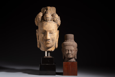A Khmer-style carved stone head and a carved stone head of a deity, Thailand and Cambodia, 20th C. or earlier