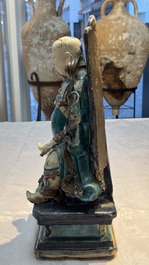 A Chinese fahua-glazed biscuit figure of Zhenwu, Ming