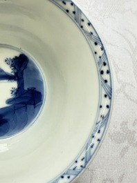 A Chinese blue and white 'Hunting Scene' cup and saucer, Kangxi