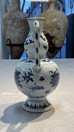 A Chinese blue and white 'Floral' ewer, Transitional period