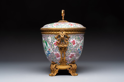 A gilt-bronze mounted famille rose-style covered bowl and two vases, one with cover, Samson, Paris, 19th C.