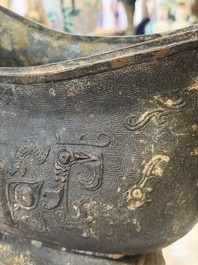 A rare and large Chinese archaistic bronze pouring vessel and cover, Gong 觥, Qing