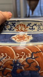 A Chinese blue, white and iron-red decorated 'Mythical Animals' vase and cover, 19th C.