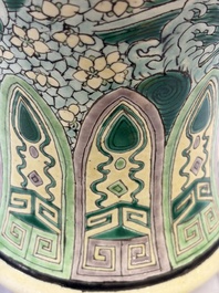 A Chinese verte biscuit 'Dragon Gate Carp 鯉躍龍門' vase on a wooden stand, Xuande mark, 19th C.