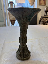 A Chinese archaic bronze wine vessel with Taotie design, Gu 觚, Shang