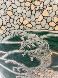 A Chinese verte biscuit 'Dragon Gate Carp 鯉躍龍門' vase on a wooden stand, Xuande mark, 19th C.