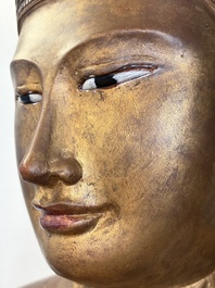 A very large Burmese mica-inlaid gilt-lacquered wooden Mandaly Buddha, 20th C.