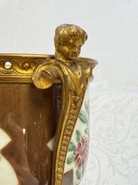 A pair of gilt-bronze-mounted Chinese famille rose capucine-ground vases and a covered bowl, Qianlong