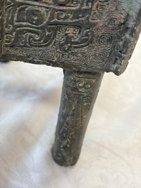 An inscribed Chinese archaic bronze food vessel with Taotie design, Ding 鼎, Western Zhou
