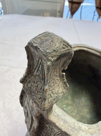 A Chinese archaic bronze wine vessel with owl design, Jia 斝, late Shang