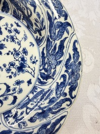 Eleven Chinese blue and white gadrooned 'Flowers and Peacocks' plates, Kangxi