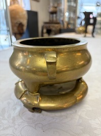 A fine Chinese bronze tripod censer and stand, Xuande mark, 17/18th C.