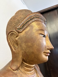 A very large Burmese mica-inlaid gilt-lacquered wooden Mandaly Buddha, 20th C.