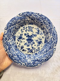 Eleven Chinese blue and white gadrooned 'Flowers and Peacocks' plates, Kangxi