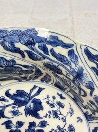 Eleven Chinese blue and white gadrooned 'Flowers and Peacocks' plates, Kangxi