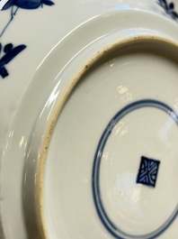 Eleven Chinese blue and white gadrooned 'Flowers and Peacocks' plates, Kangxi