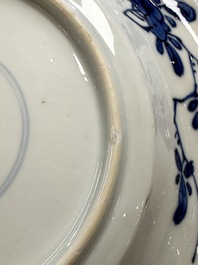Eleven Chinese blue and white gadrooned 'Flowers and Peacocks' plates, Kangxi
