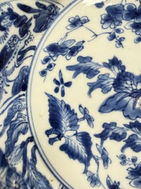 Eleven Chinese blue and white gadrooned 'Flowers and Peacocks' plates, Kangxi