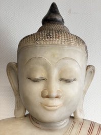 A monumental Burmese white marble Post-Pagan Buddha with traces of gilt-lacquer, Ava Kingdom, 17th C
