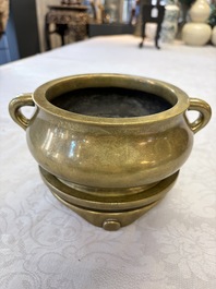 A fine Chinese bronze censer with loop handles and stand, Xuande mark, 18th C.