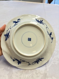 Eleven Chinese blue and white gadrooned 'Flowers and Peacocks' plates, Kangxi