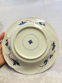 Eleven Chinese blue and white gadrooned 'Flowers and Peacocks' plates, Kangxi