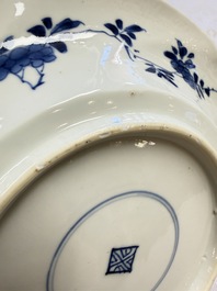Eleven Chinese blue and white gadrooned 'Flowers and Peacocks' plates, Kangxi
