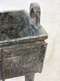 An inscribed Chinese archaic bronze food vessel with Taotie design, Ding 鼎, Western Zhou