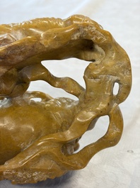 A fine Chinese soapstone group of Buddhist lions on wooden stand, 19th C.