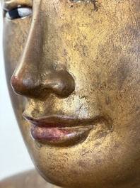 A very large Burmese mica-inlaid gilt-lacquered wooden Mandaly Buddha, 20th C.