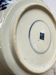 Eleven Chinese blue and white gadrooned 'Flowers and Peacocks' plates, Kangxi