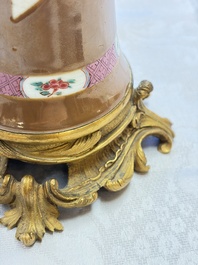 A pair of gilt-bronze-mounted Chinese famille rose capucine-ground vases and a covered bowl, Qianlong