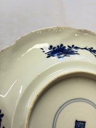 Eleven Chinese blue and white gadrooned 'Flowers and Peacocks' plates, Kangxi