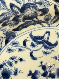 Eleven Chinese blue and white gadrooned 'Flowers and Peacocks' plates, Kangxi