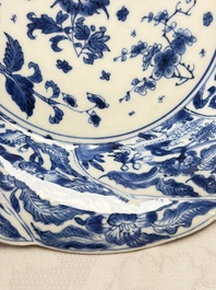 Eleven Chinese blue and white gadrooned 'Flowers and Peacocks' plates, Kangxi