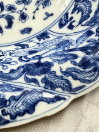 Eleven Chinese blue and white gadrooned 'Flowers and Peacocks' plates, Kangxi