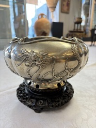 A fine Chinese silver bowl with relief dragon design on reticulated wooden stand, Tai Chang Long 泰昌隆 mark, 19th C.