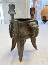 A Chinese archaic bronze wine vessel with owl design, Jia 斝, late Shang