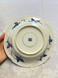 Eleven Chinese blue and white gadrooned 'Flowers and Peacocks' plates, Kangxi