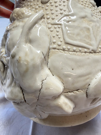 A Chinese Nanking white-glazed 'hu' vase with figural relief design, 19th C.