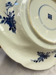 Eleven Chinese blue and white gadrooned 'Flowers and Peacocks' plates, Kangxi