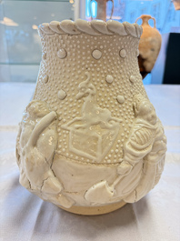 A Chinese Nanking white-glazed 'hu' vase with figural relief design, 19th C.