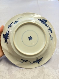 Eleven Chinese blue and white gadrooned 'Flowers and Peacocks' plates, Kangxi
