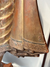 A very large Burmese mica-inlaid gilt-lacquered wooden Mandaly Buddha, 20th C.