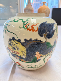A fine Chinese famille verte 'Buddhist Lions' jar and a reticulated wooden cover, 19th C.