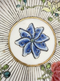 A Chinese famille rose cup and saucer with floral design, Yongzheng